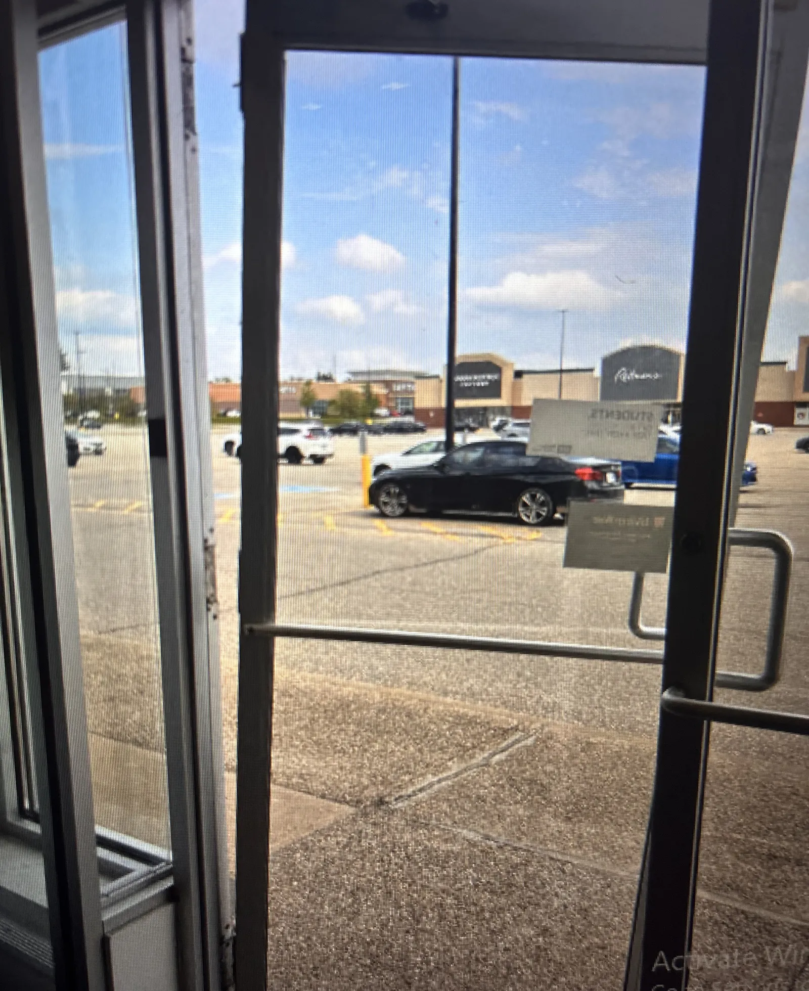 Mobile locksmith unlocking a door during an emergency call in Burlington